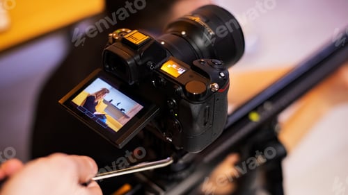 Preview: Camera shooting a young girl with tablet on sofa at home