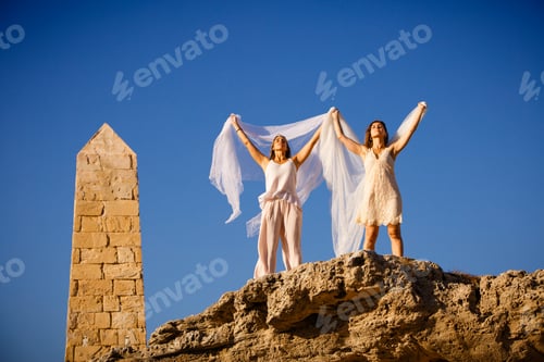 Preview: Young women with textile on stone