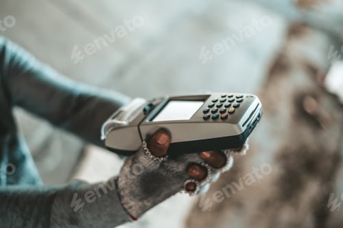Preview: Beggars sitting under the overpass with a credit card and credit card swipe machine