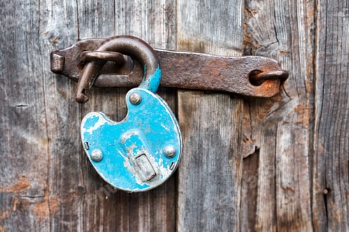 Preview: Blue old rusty unlocked padlock on wooden door