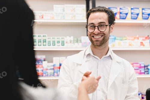Preview: Buyer in pharmacy giving druggist medical prescription for medications, drugs, antibiotics, pills