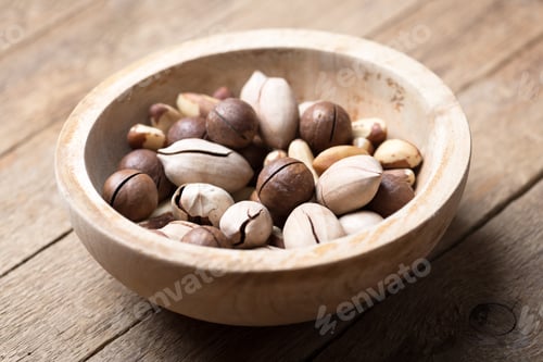 Preview: Dried mixed nuts in wooden bowl closeup