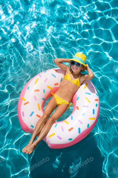 Preview: Top view portrait of child in the swimming pool