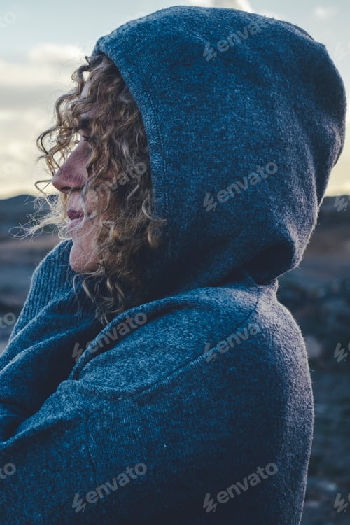 Preview: One woman hugging herself with love and care and smile looking enjoying scenic destination travel