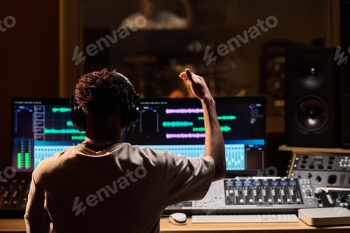 Preview: Young Adult Black Man Conducting Music Production Session in Professional Studio