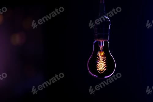 Preview: Silhouette of a glowing lamp in the dark copy space.