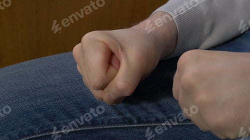 Preview: Man clenched fist. Man clenches his fist when his chastises the chief
