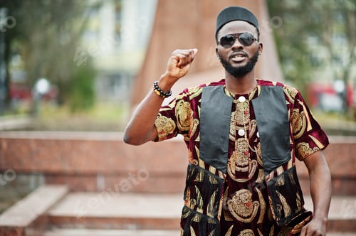 Preview: African stylish and handsome man in traditional outfit
