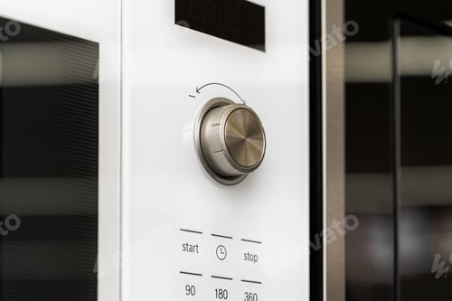 Preview: New modern microwave oven in a shop, close up