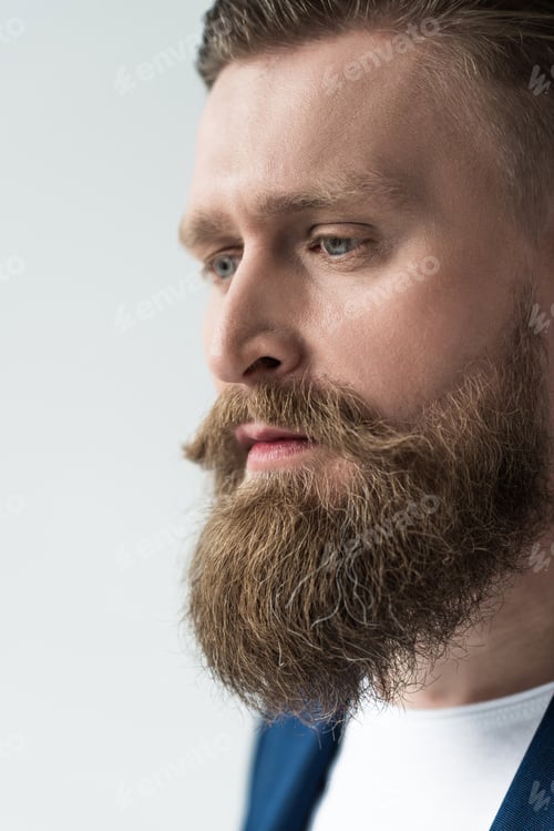 Preview: Handsome man with stylish beard and mustache isolated on light background