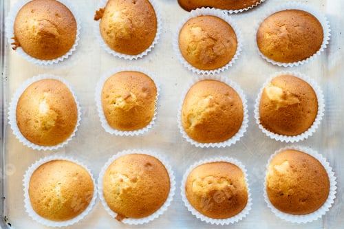 Preview: Homemade muffins on tray. Top view.