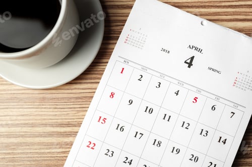 Preview: Coffee cup and calendar mark a spring day in April with important dates highlighted