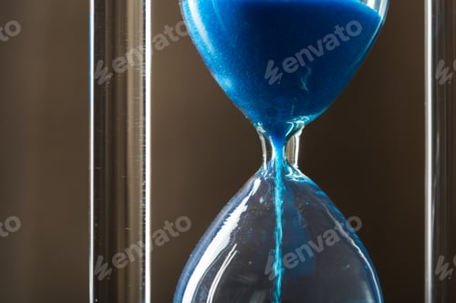 Preview: Time is passing. Blue hourglass close up