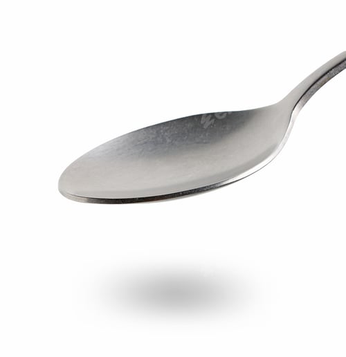 Preview: empty spoon on white background