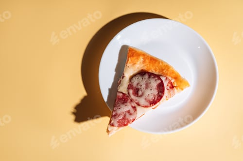 Preview: Slice of pizza with sausage on white plate