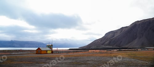 Preview: Pyramiden village in Svalbard showcasing abandoned buildings and stunning mountain backdrop