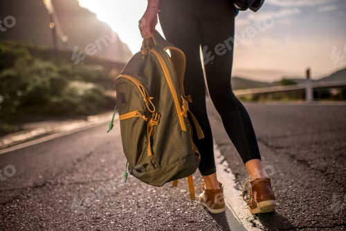 Preview: Traveler with backpack on the road