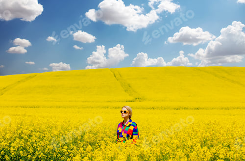 Preview: Beautiful female in 90s stylish shirt in rapeseed field