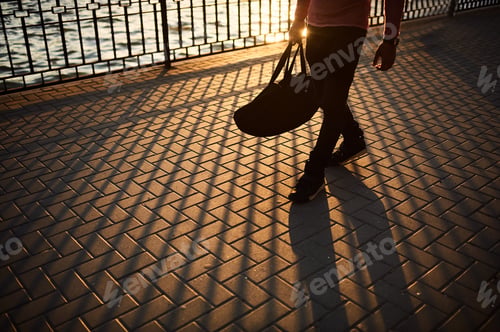 Preview: Close up male legs walking on sunset