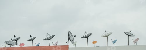 Preview: Many old communication satellite dishes expired and left on rooftops.