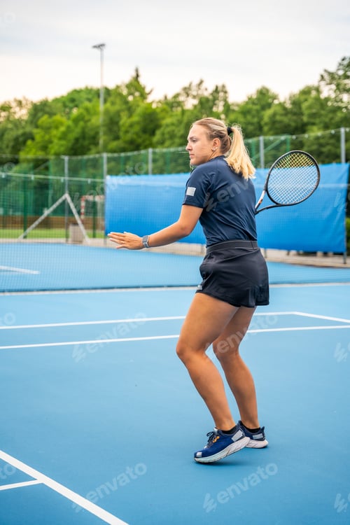 Preview: Professional female tennis player playing the tennis on outside court