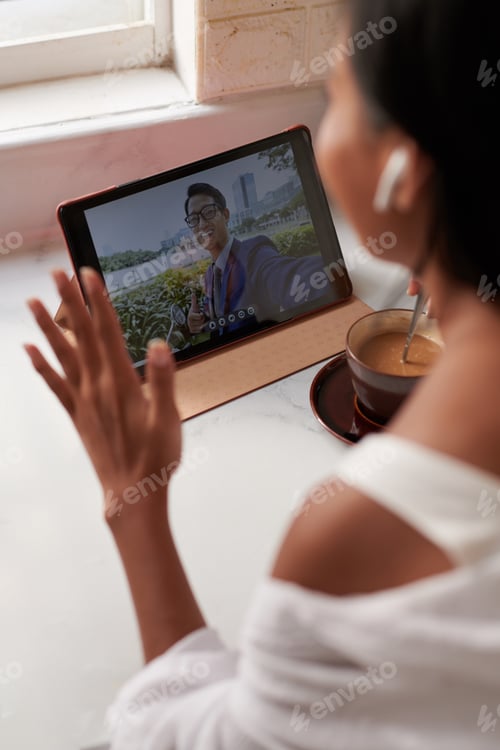 Preview: Woman Making Video Call to Coworker