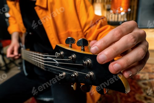 Preview: rock performer with electric guitar in recording studio recording playing track