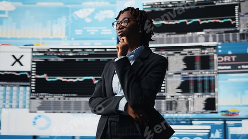 Preview: Management executive comparing company metrics on digital videowall