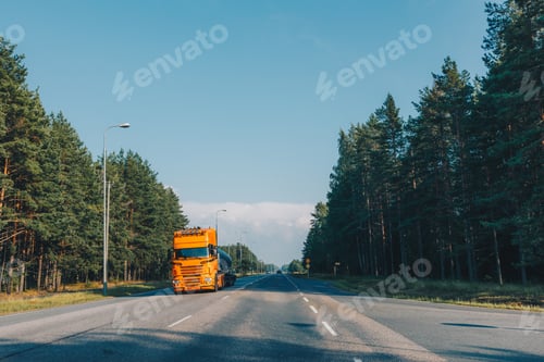 Preview: Fuel tanker semi-truck driving on the highway asphalt road in summer Finland