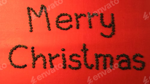 Preview: "Merry Christmas" Coffee Bean Text And Christmas Decorations On Red Paper Texture