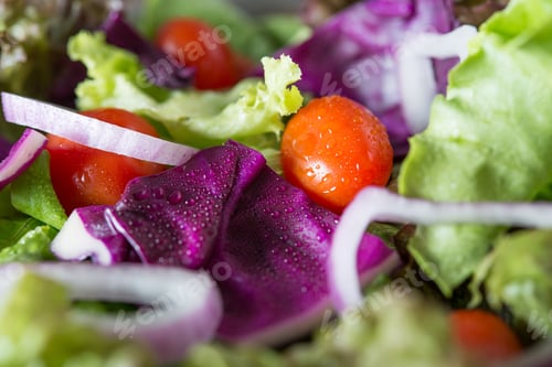Preview: Fresh vegetables salad in the bowl with rustic old wooden background. Healthy food concept.