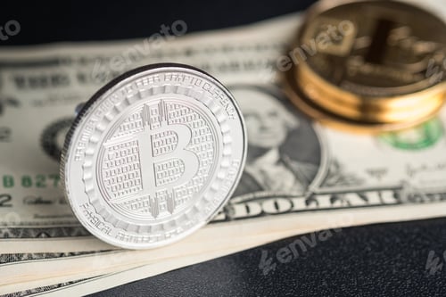 Preview: crypto currency Silver and gold Bitcoin on dollar banknote on black table