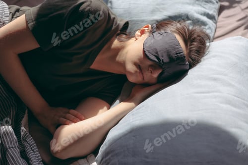 Preview: woman sleeps during the day with a mask over her eyes and wakes up