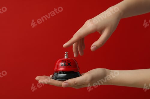 Preview: Bell for sex on a red background.