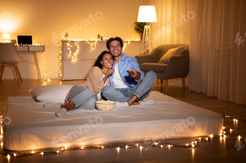 Preview: Happy Spouses Watching Television Switching Channels Spending Evening At Home