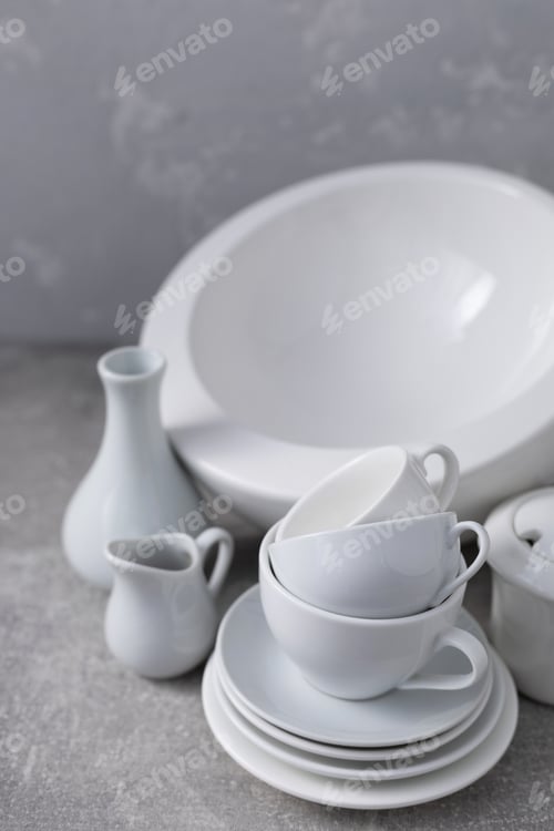 Preview: Empty crockery set or white ceramic dishes. White kitchen dishware and tableware on table