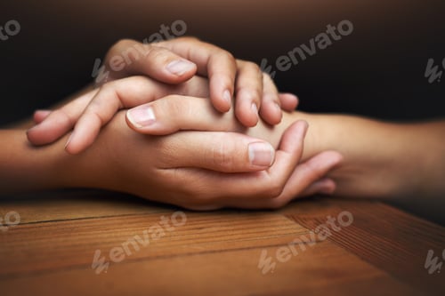 Preview: Cropped shot of two unrecognizable people holding hands in comfort