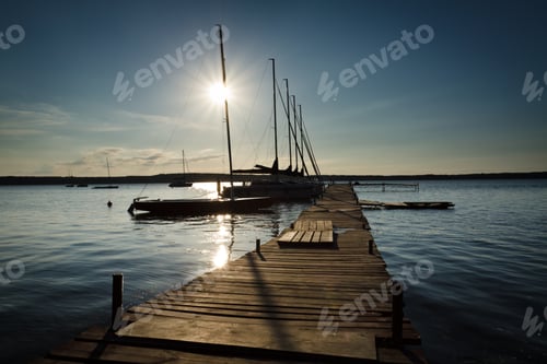 Preview: Sunset in wooden harbour at summer