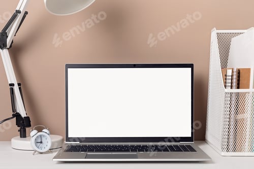 Preview: Empty laptop screen, desktop organizer with desk lamp and office supplies