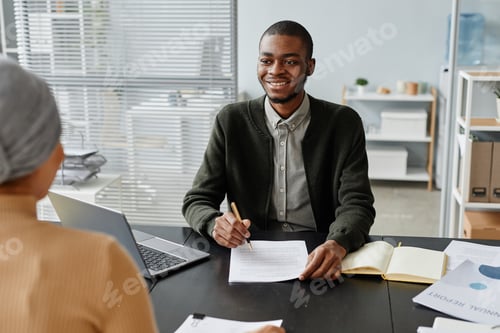 Preview: Smiling Black Man in Job interview