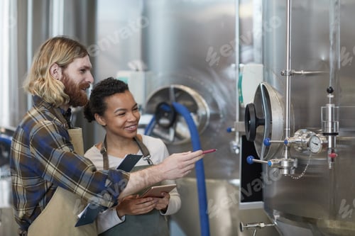 Preview: Two Young Workers Controlling Production at Plant