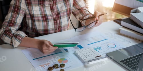 Preview: Young Asian woman checking bills, taxes, bank account balance and calculating credit card expenses