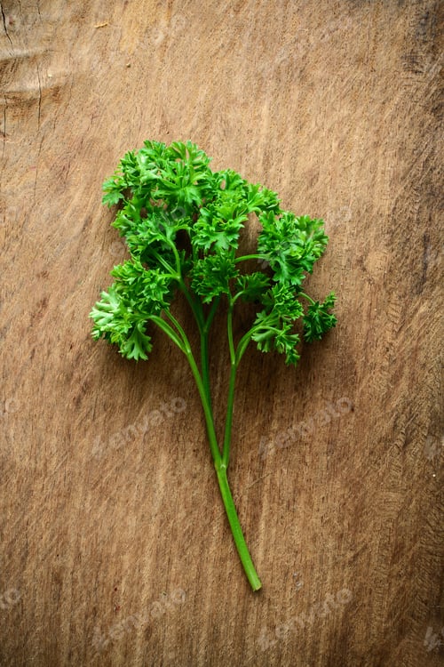 Preview: Bunch of parsley on a rustic wooden table