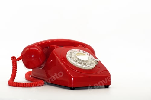 Preview: Closeup shot of a red vintage phone isolated on a white background
