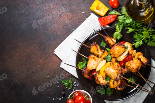 Preview: Chicken kebab with vegetables on skewers top view