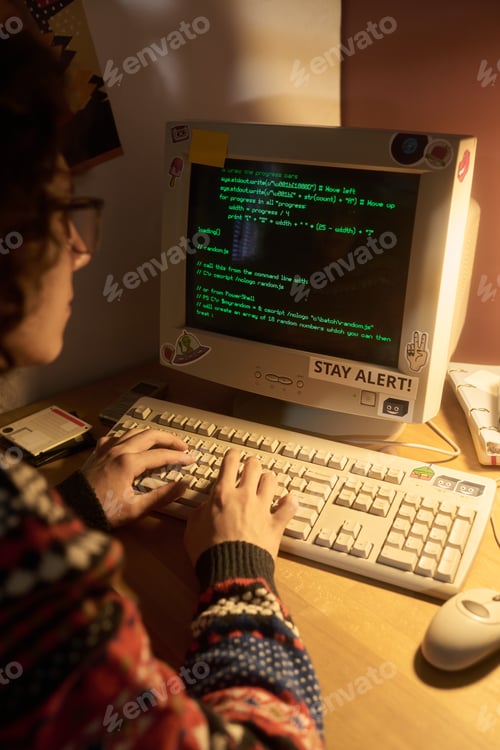 Preview: Programming on Desktop Computer During Night with Lamp Light