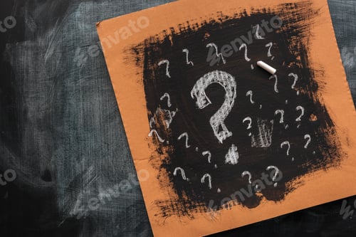 Preview: Sketched question marks on cardboard paper