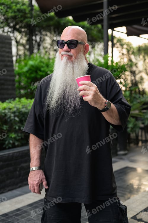 Preview: Bald Man with Long White Beard Holding Coffee Outdoors