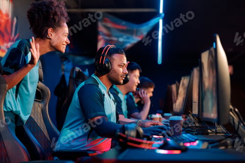 Preview: Professional gamers involved in team play in cyber club