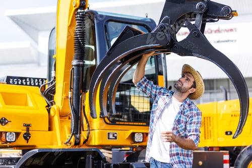 Preview: Farmers inspect agricultural machinery before purchasing.
